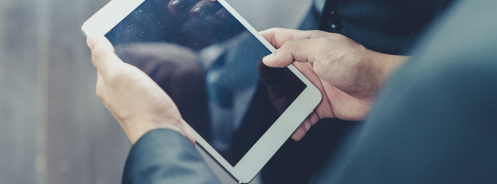 Person holding a blacked out iPad